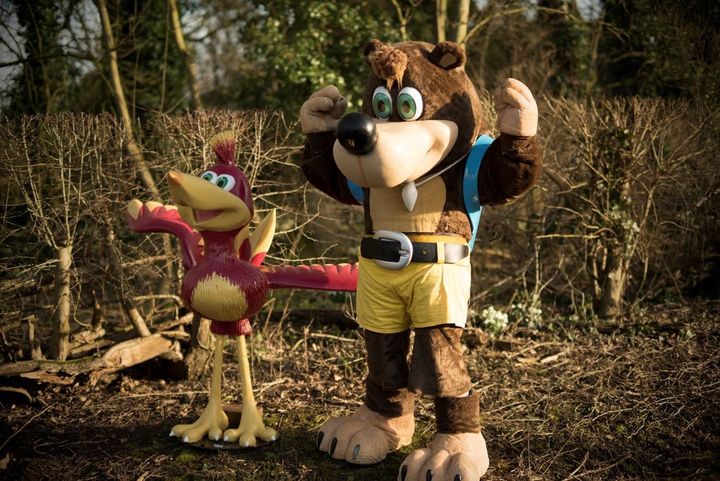 Me in a Banjo suit, standing next to a Kazooie statue